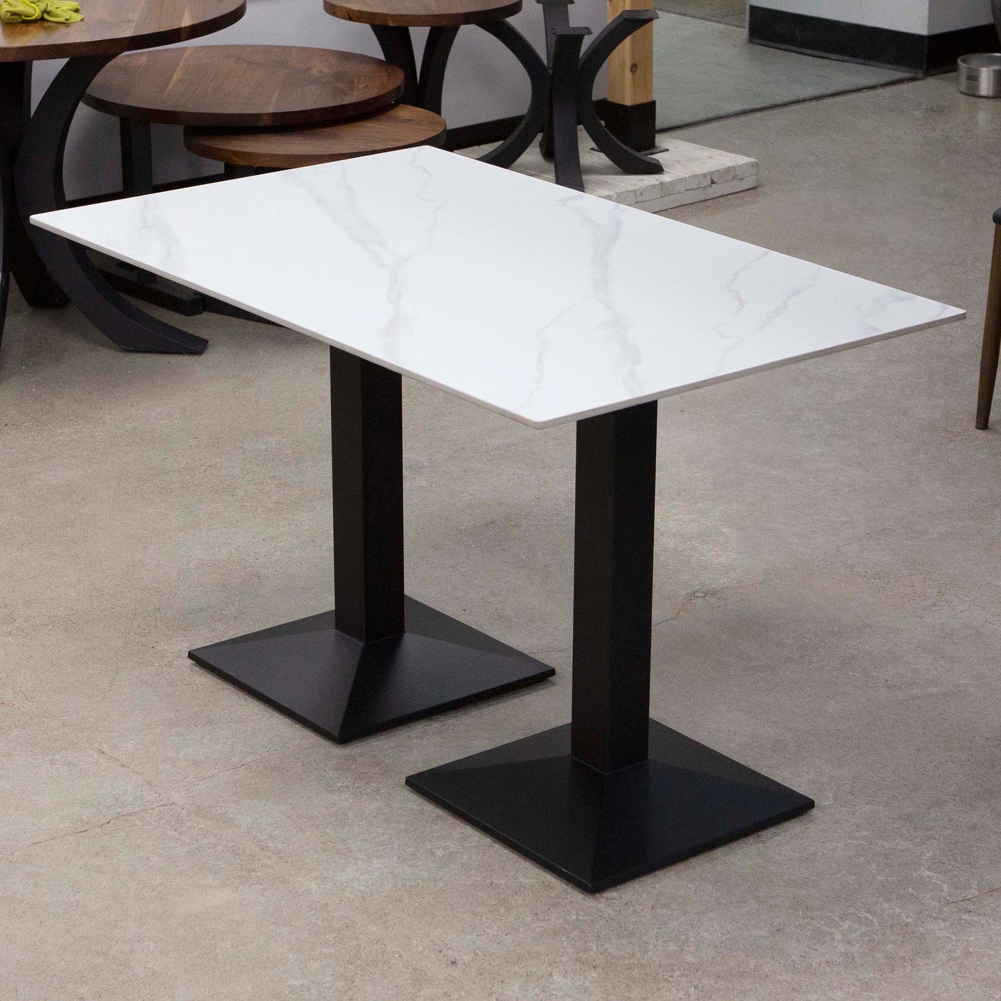 white sintered stone restaurant tables