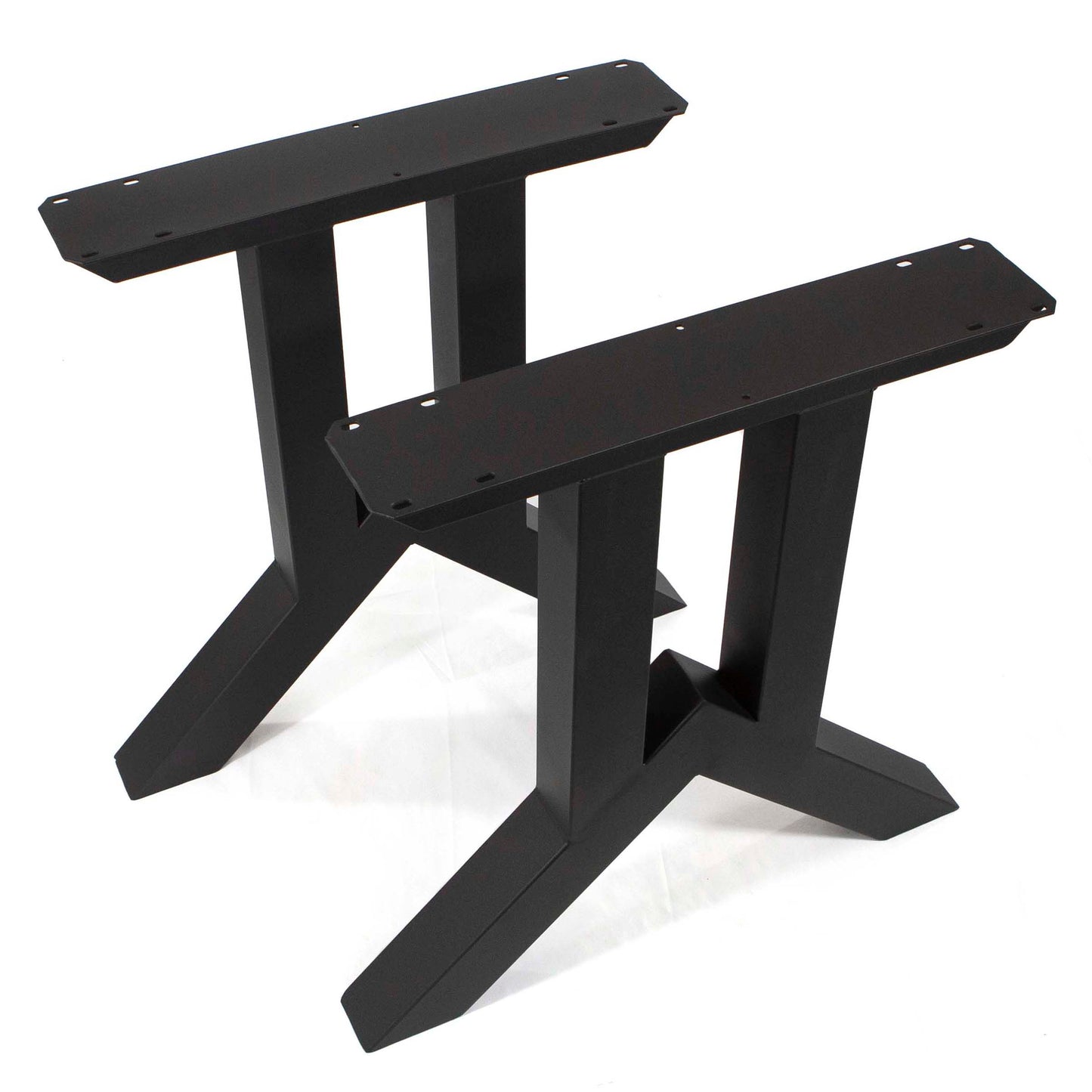 Two black metal table legs on a white background