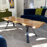 a coffee table with black Y-shaped steel legs