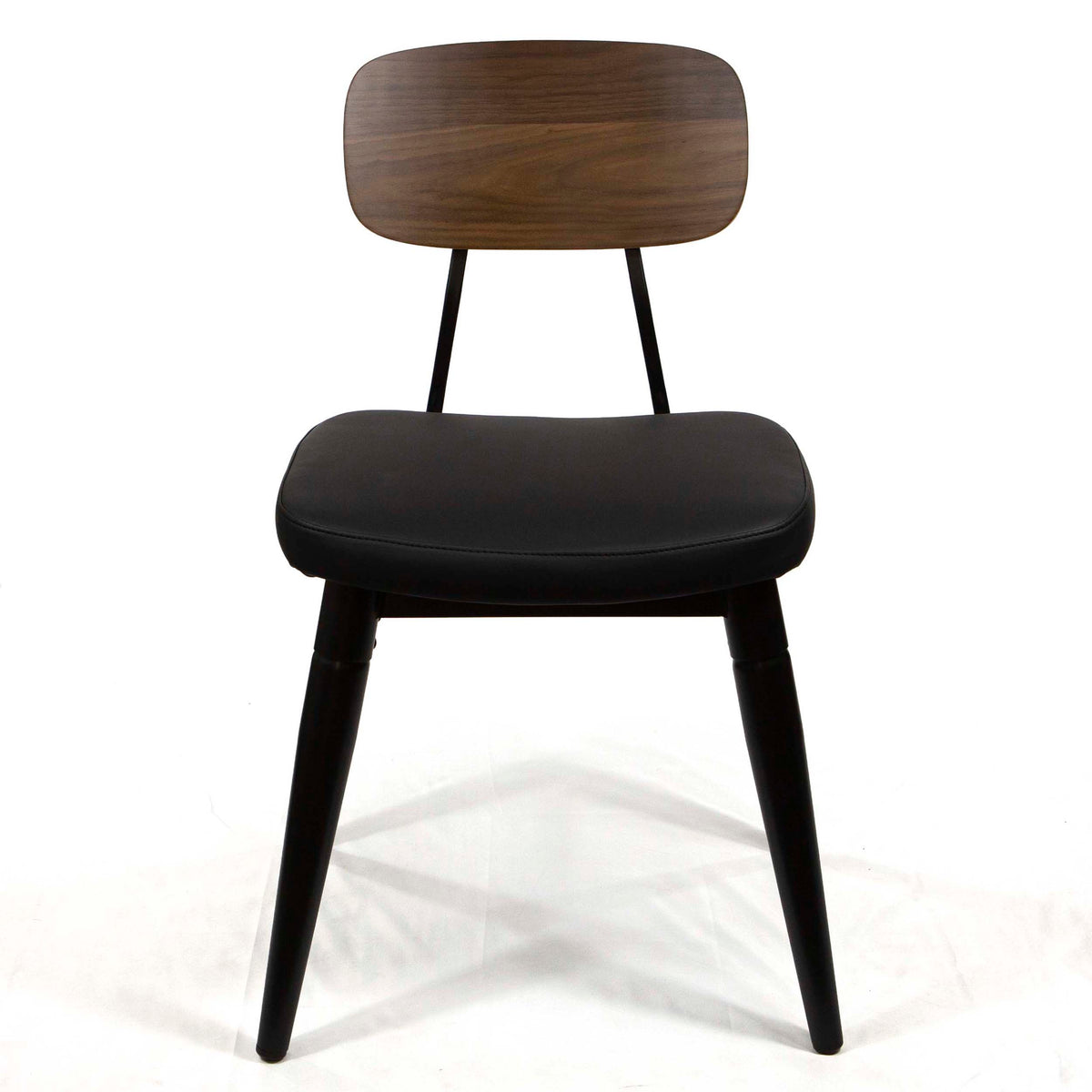 A mid-century modern dining chair featuring a dark brown wood grain backrest, a black upholstered seat cushion, and black tapered legs, shown against a plain white background.