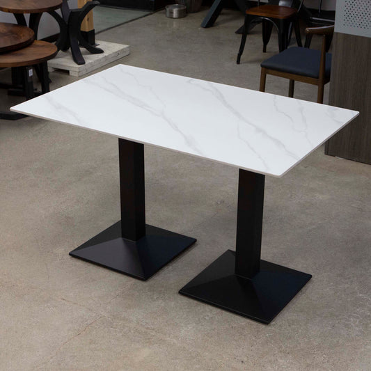 white sintered stone restaurant table