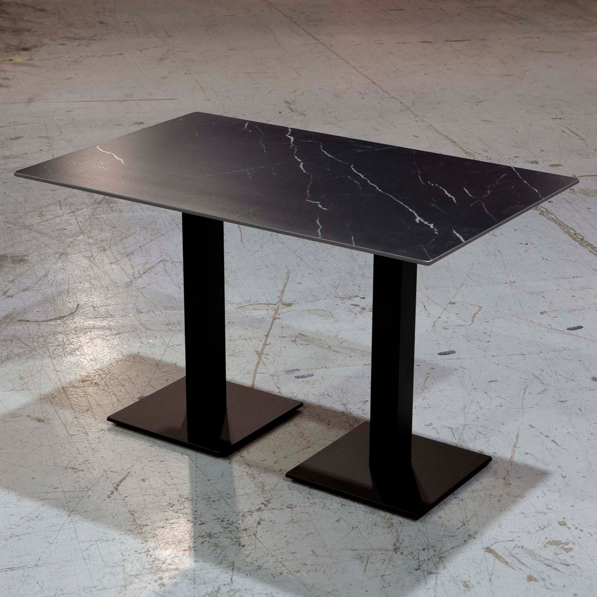 black sintered stone restaurant tables