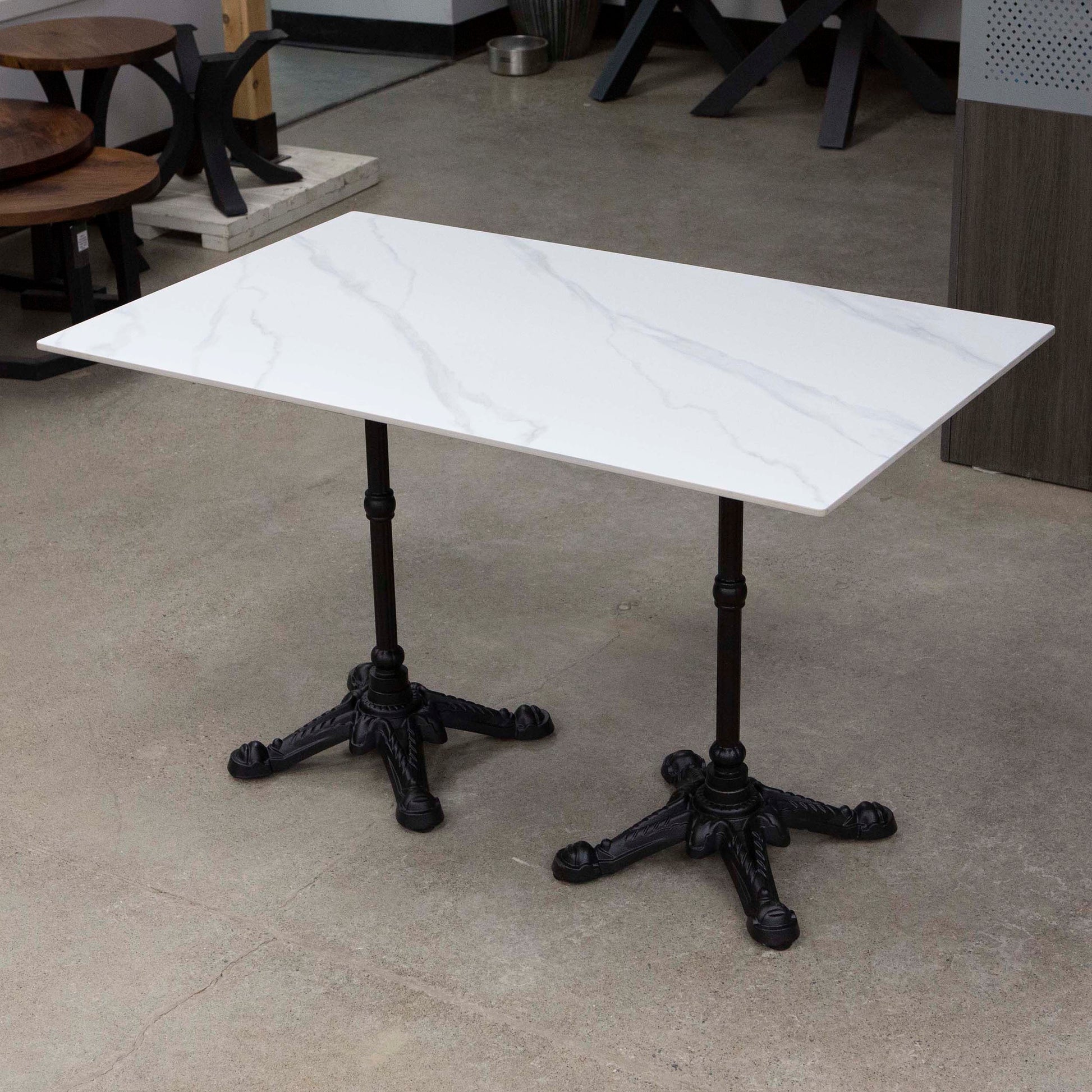white sintered stone restaurant tables