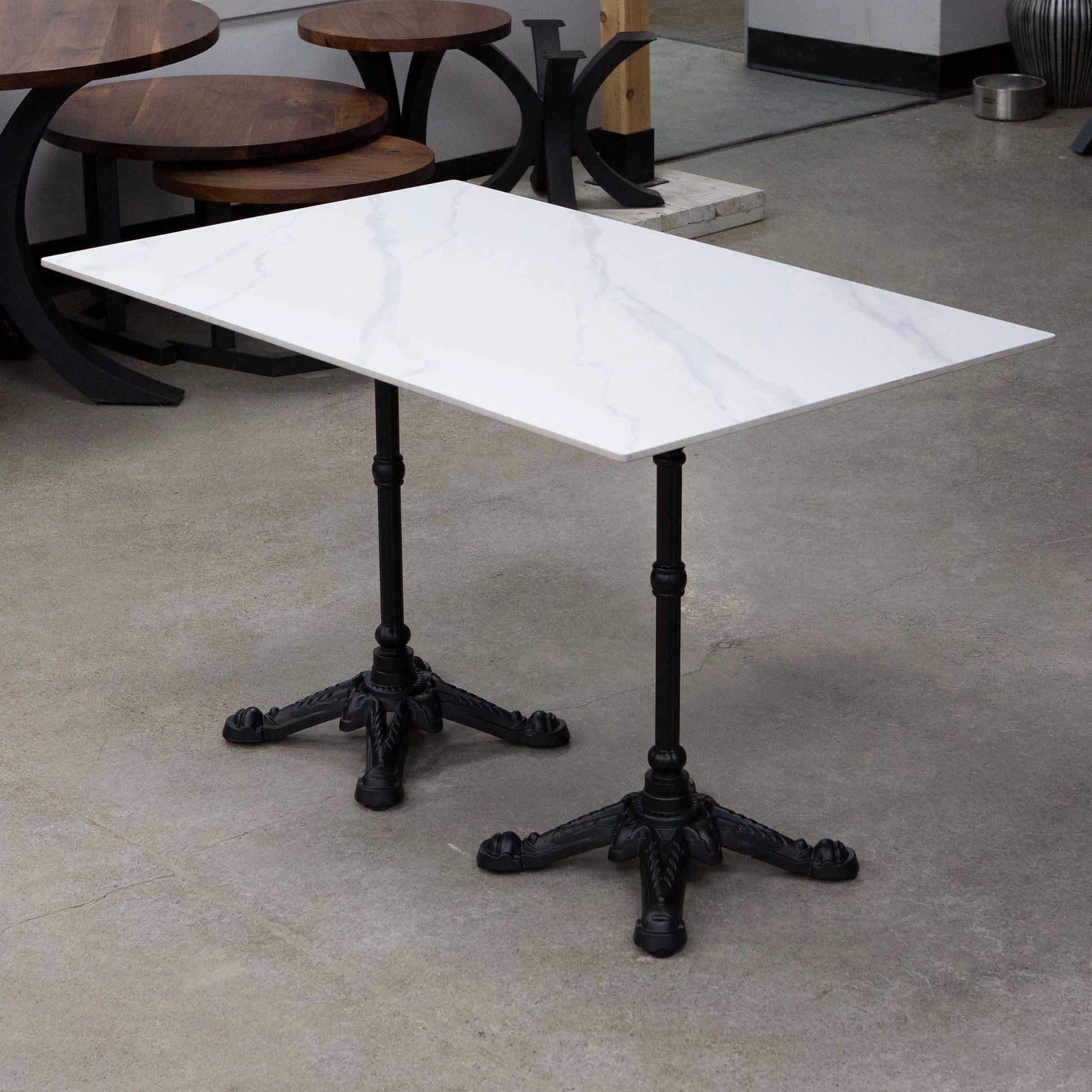 white sintered stone restaurant tables
