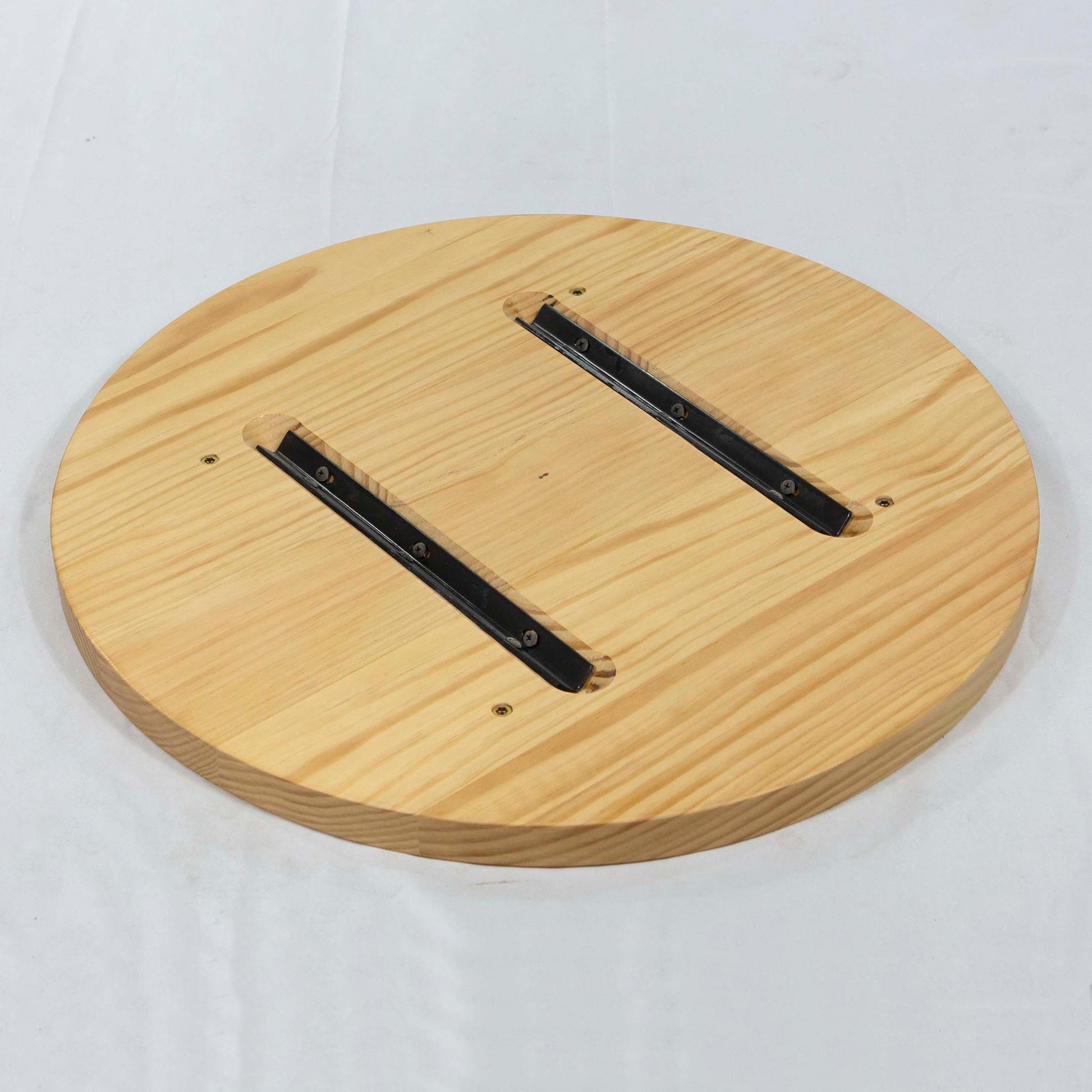 back side of round pine table tops