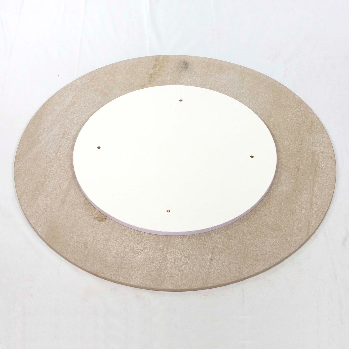 back of white round sintered stone table tops