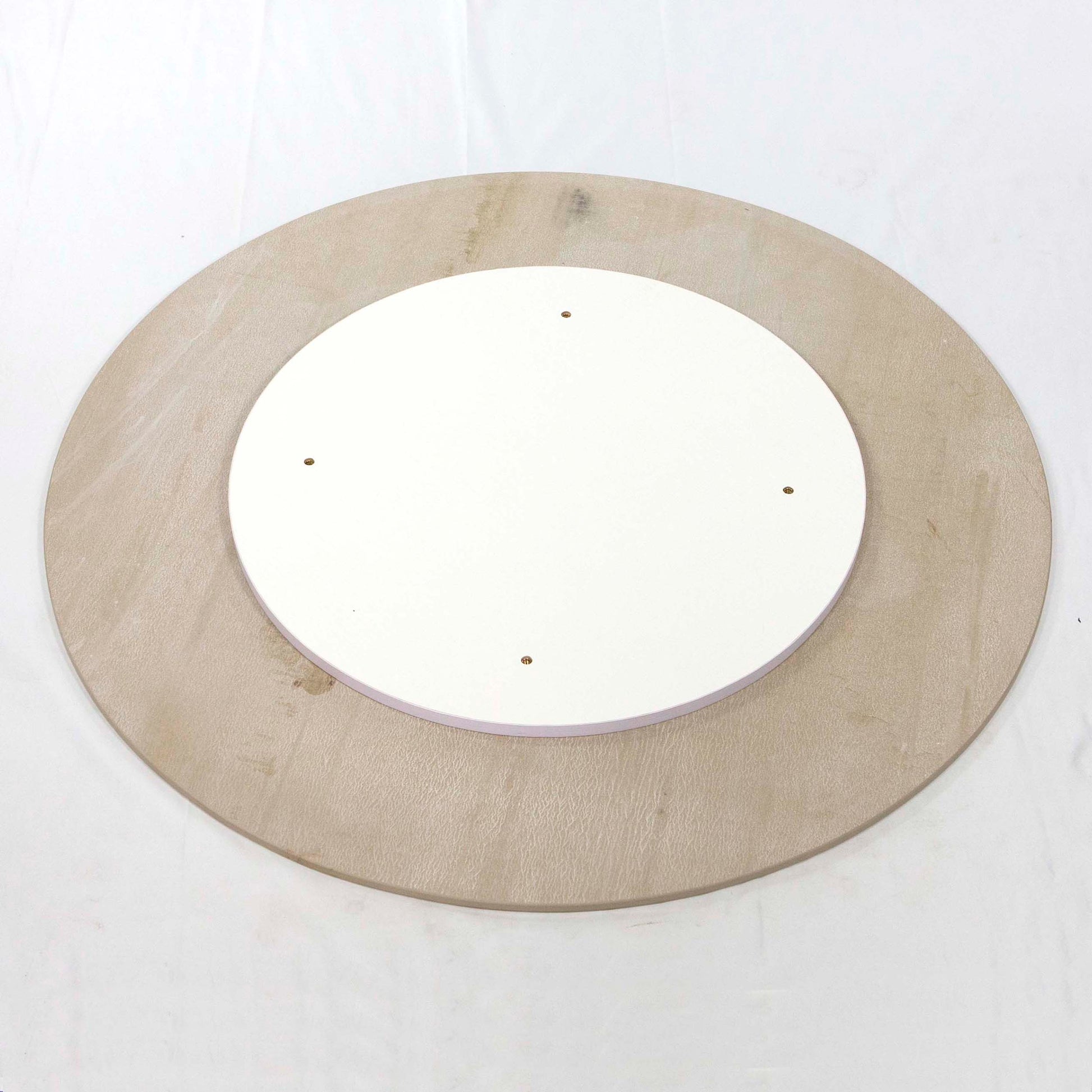 back of white round sintered stone table tops
