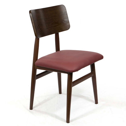 A mid-century modern dining chair featuring a dark brown wood frame with tapered legs and a curved backrest, paired with a dusty rose upholstered seat cushion, shown against a plain white background.